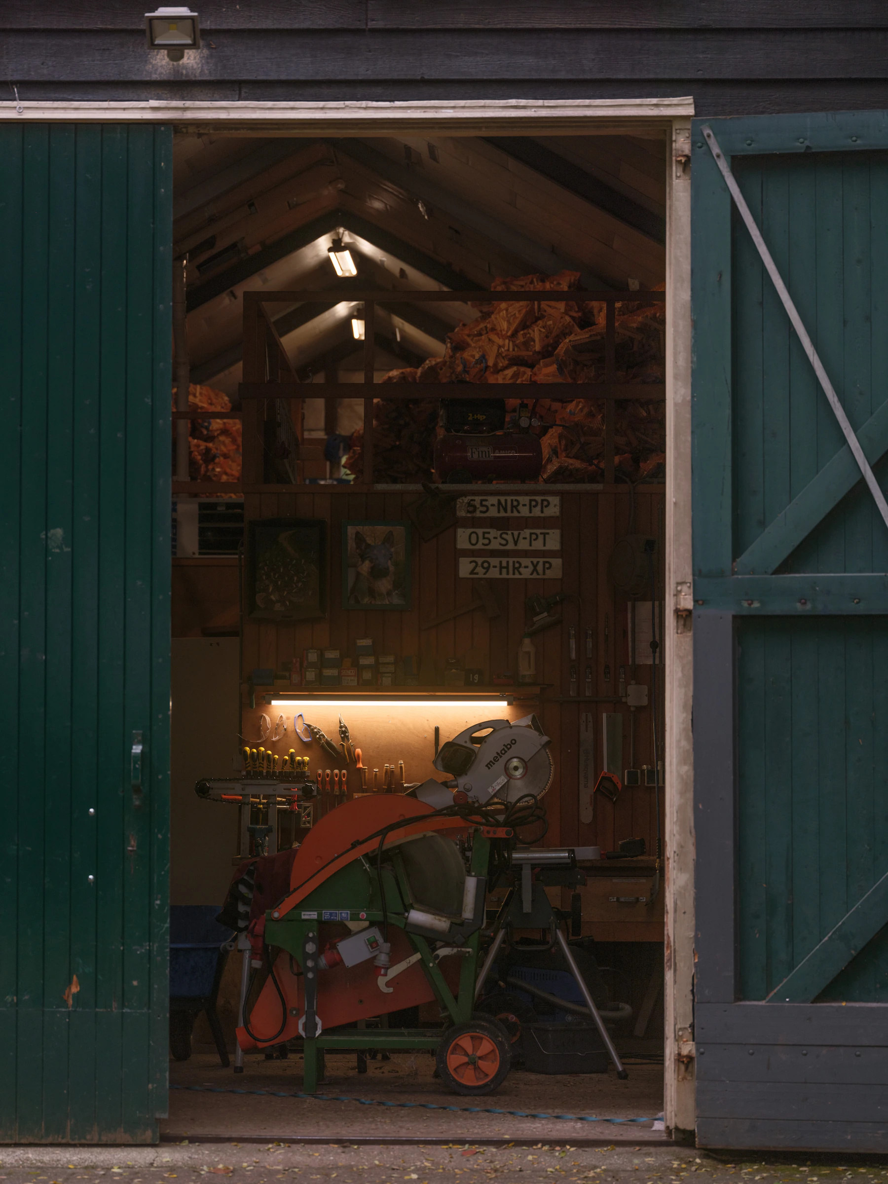 Workshop interior with power tools, cutting equipment and an active workbench