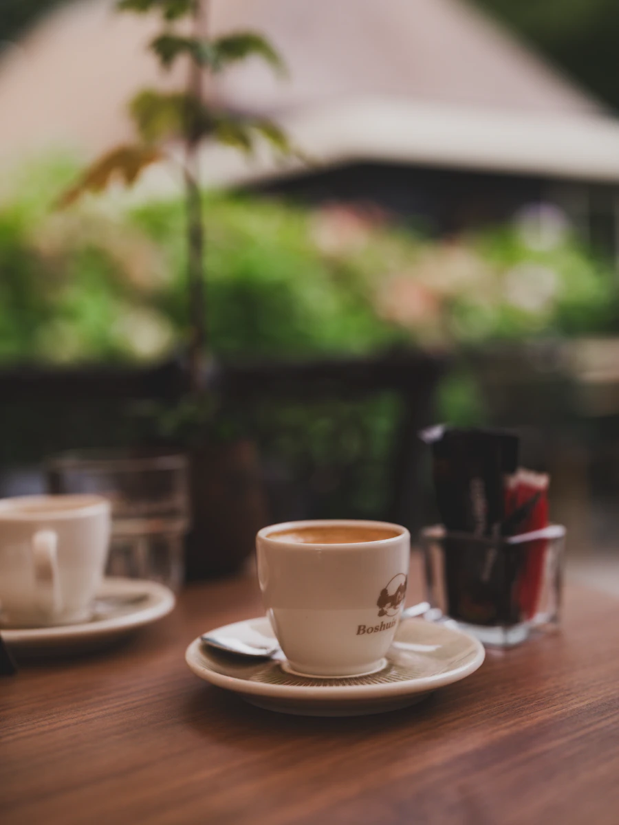 Coffee cup on a wooden restaurant table