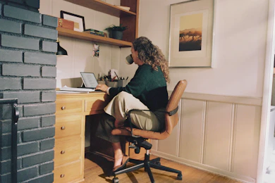 Woman working at desk with coffee