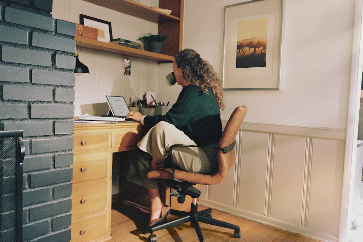 Woman working at a desk in a home office