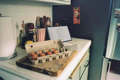 Carton of brown eggs on a kitchen counter