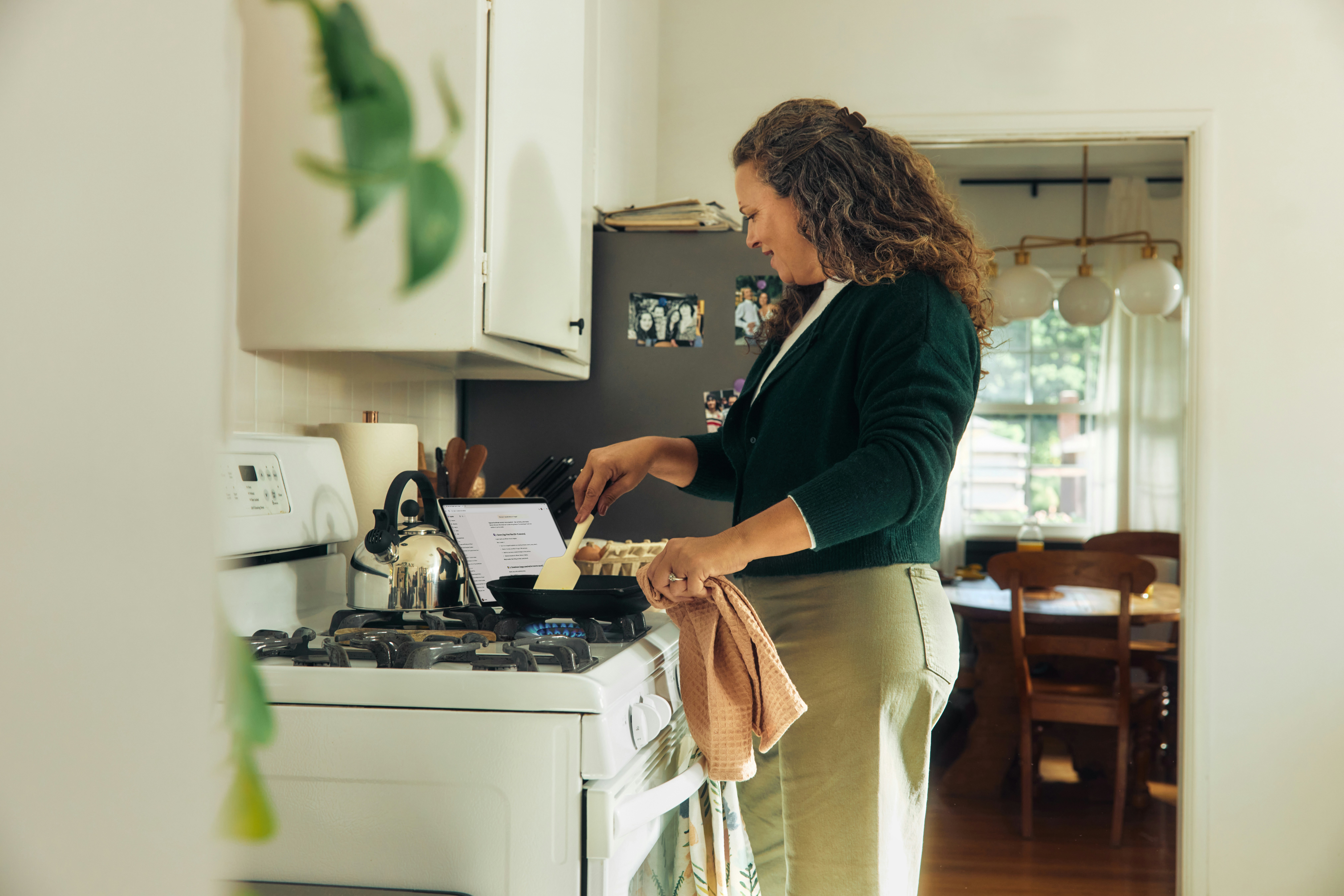 Woman cooking on a stovetop in a kitchen