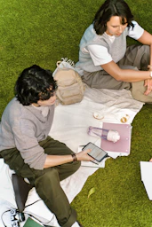 Two people having a picnic on the grass