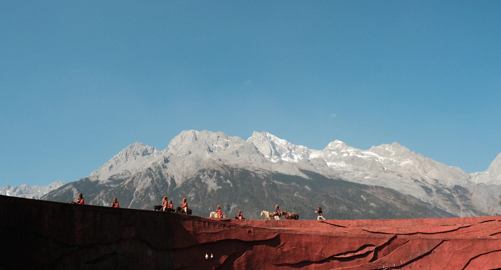 Amandayan Overlooks Lijiang's Old Town Beneath Jade Dragon Snow Mountain