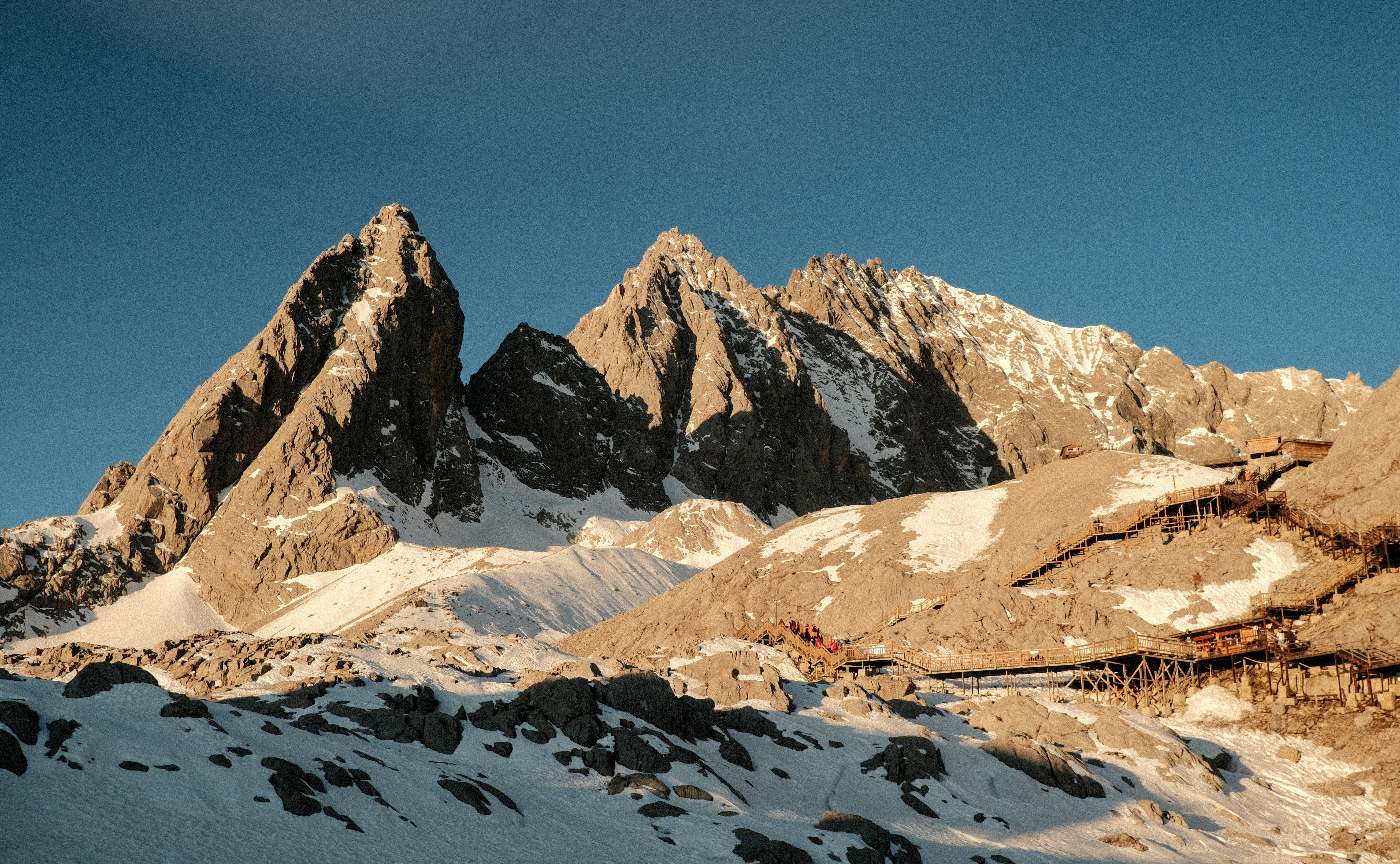 Jagged mountain peaks bathed in golden sunlight