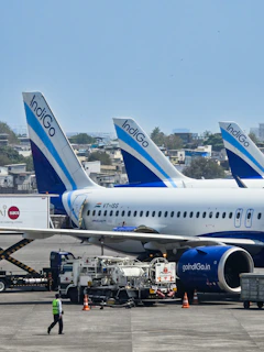 Indigo airplanes lined up on the tarmac