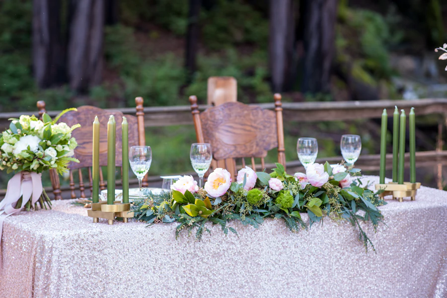 Elegant wedding table styled with candlelight, florals and refined place settings