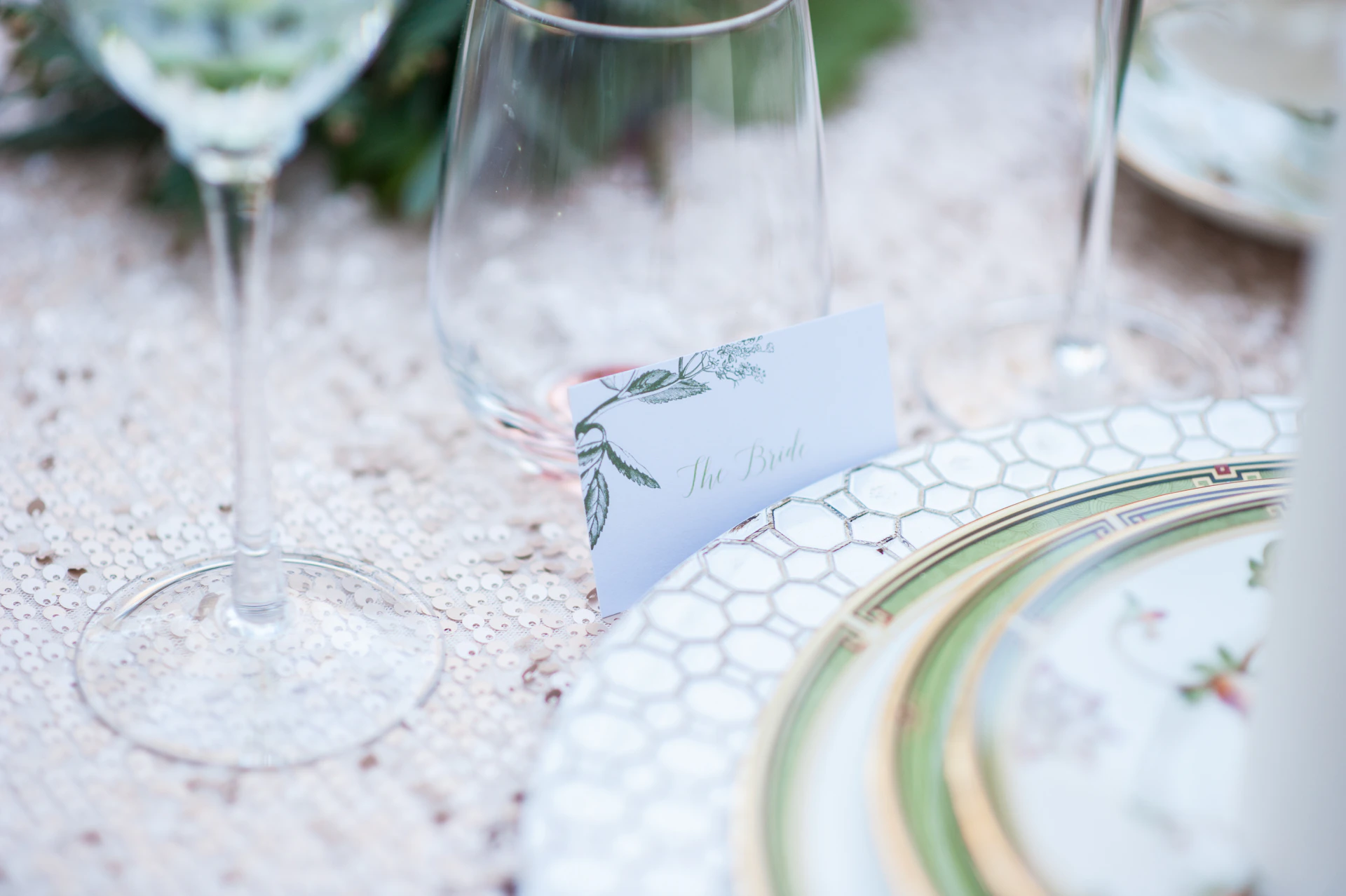 Place setting with decorative plate and wine glass