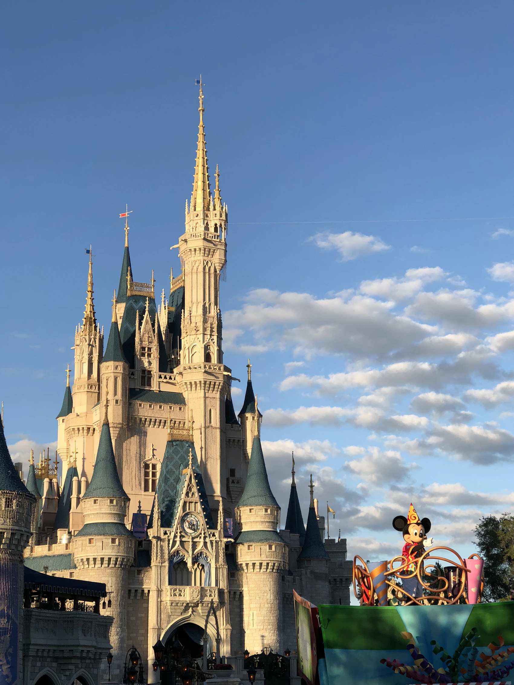 A Disney parade passing Cinderella Castle