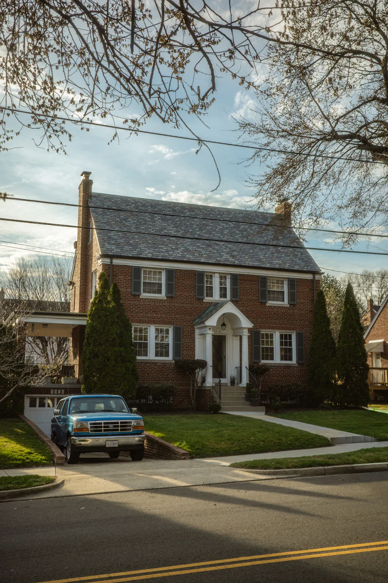 Brick home with a truck in the driveway at Bella Vista