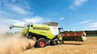 Combine harvester working in a golden wheat field
