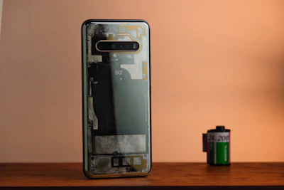 Transparent smartphone next to a film roll