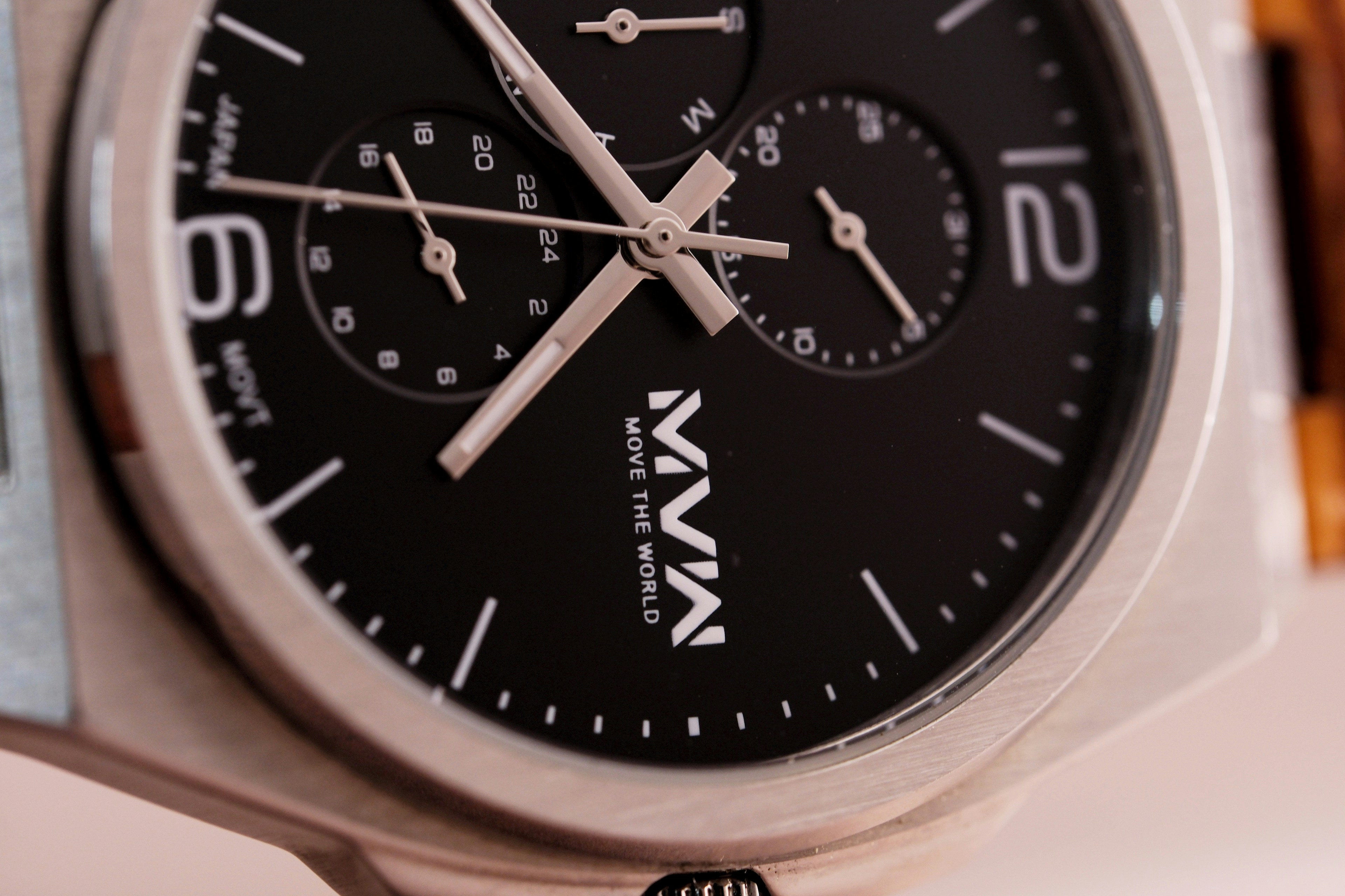 Close-up of a modern black analog watch face.