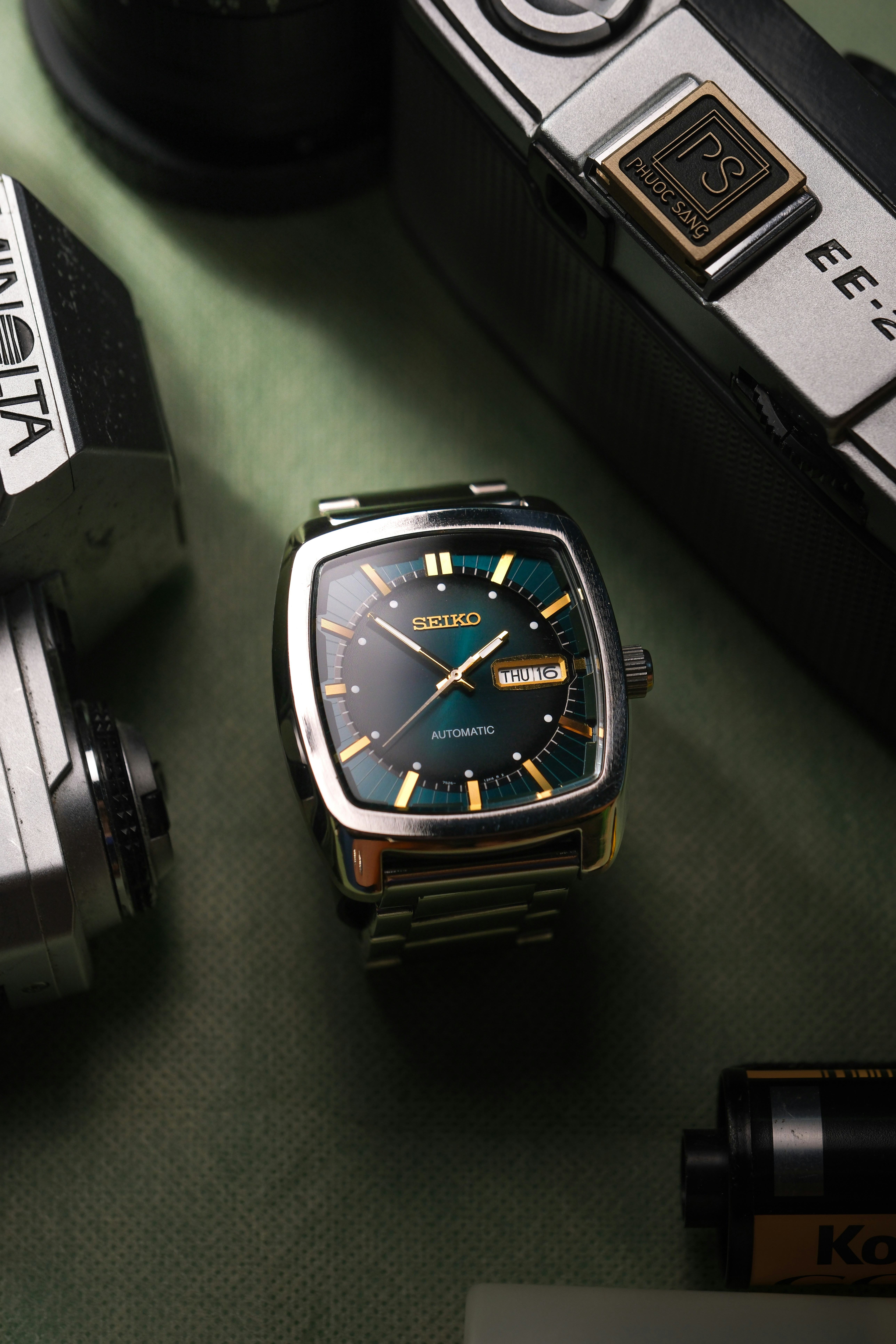 Vintage seiko watch with green dial and cameras