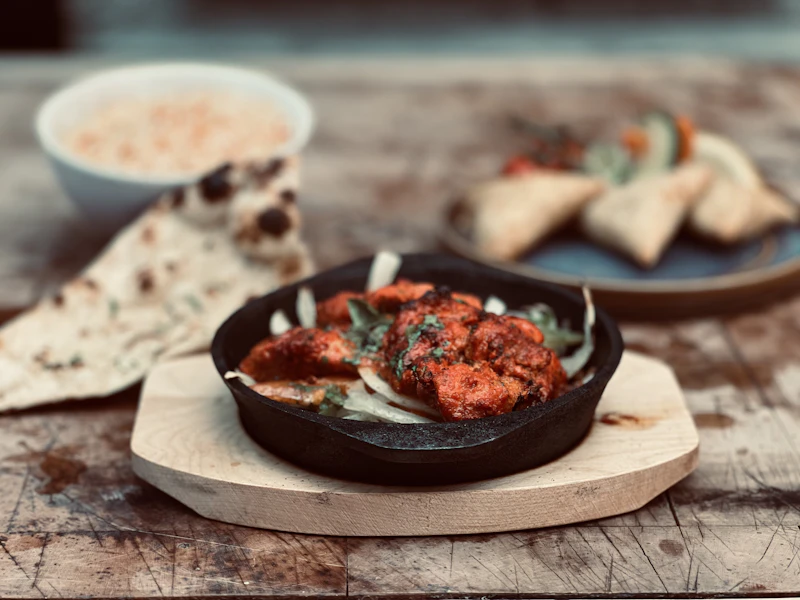 Traditional Indian thali with naan and rice
