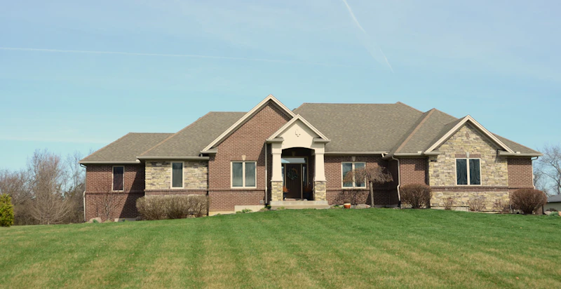 Large property with a fully cleared, manicured lawn