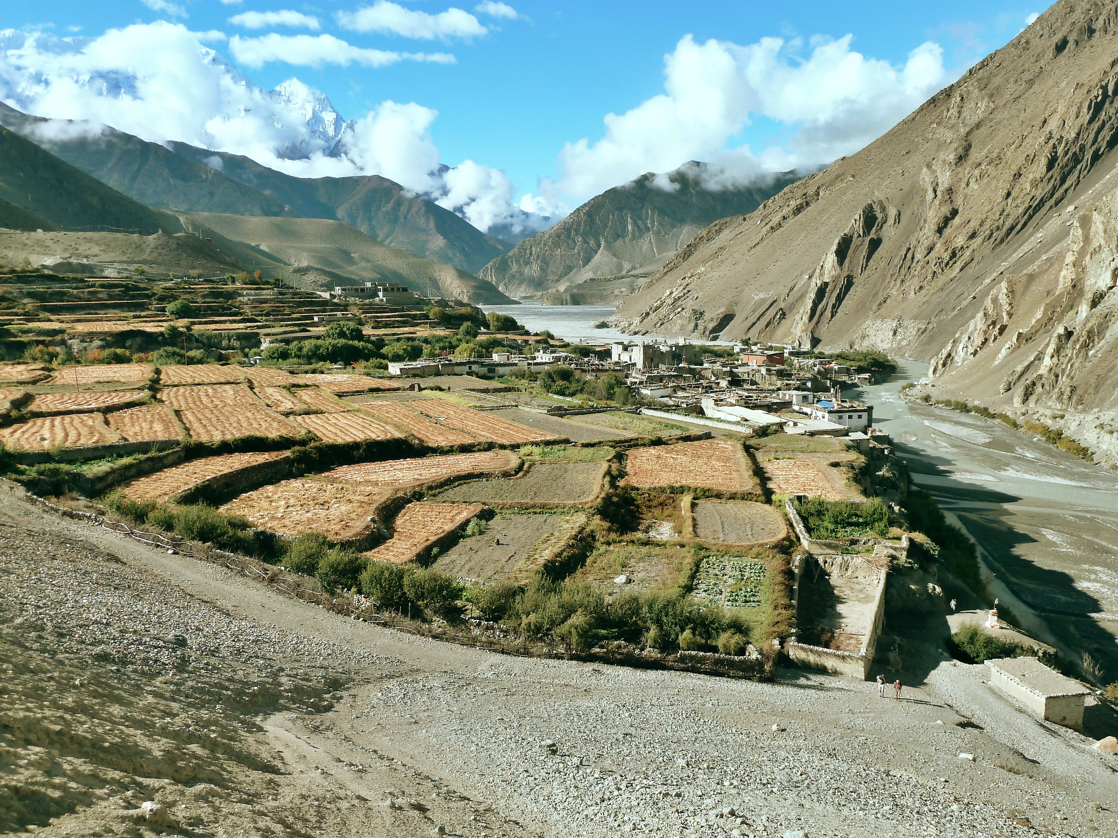 Terraced fields and a village in a dry mountain valley
