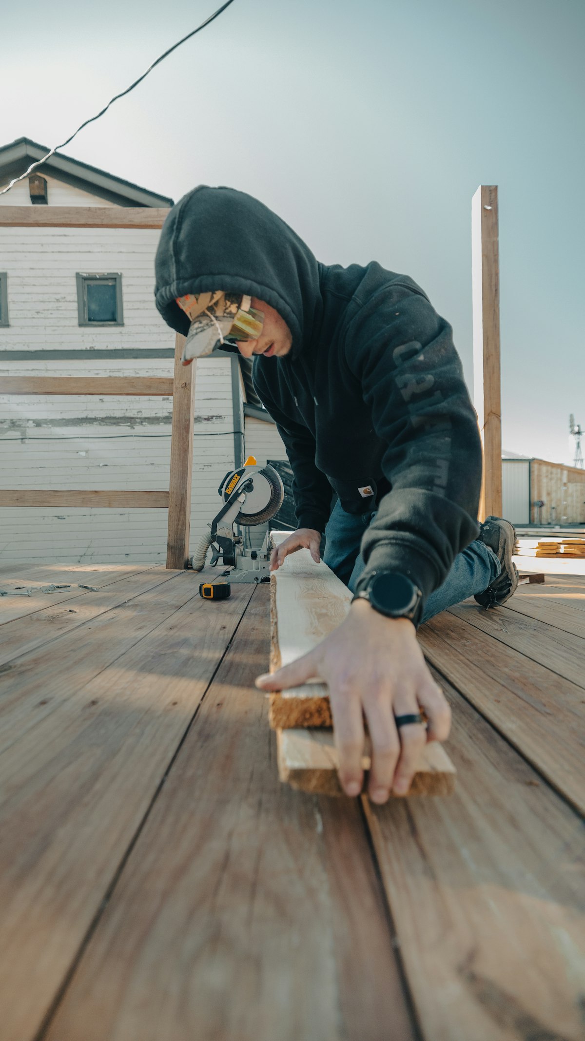 Crew cutting deck board for repair