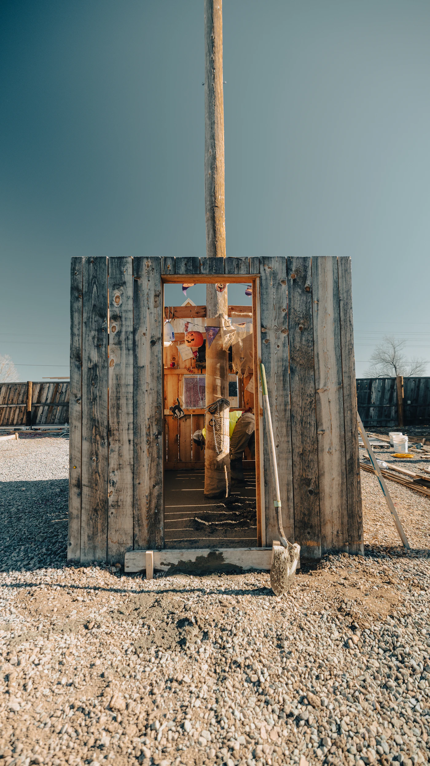 Rural construction work with building materials and tools on a property