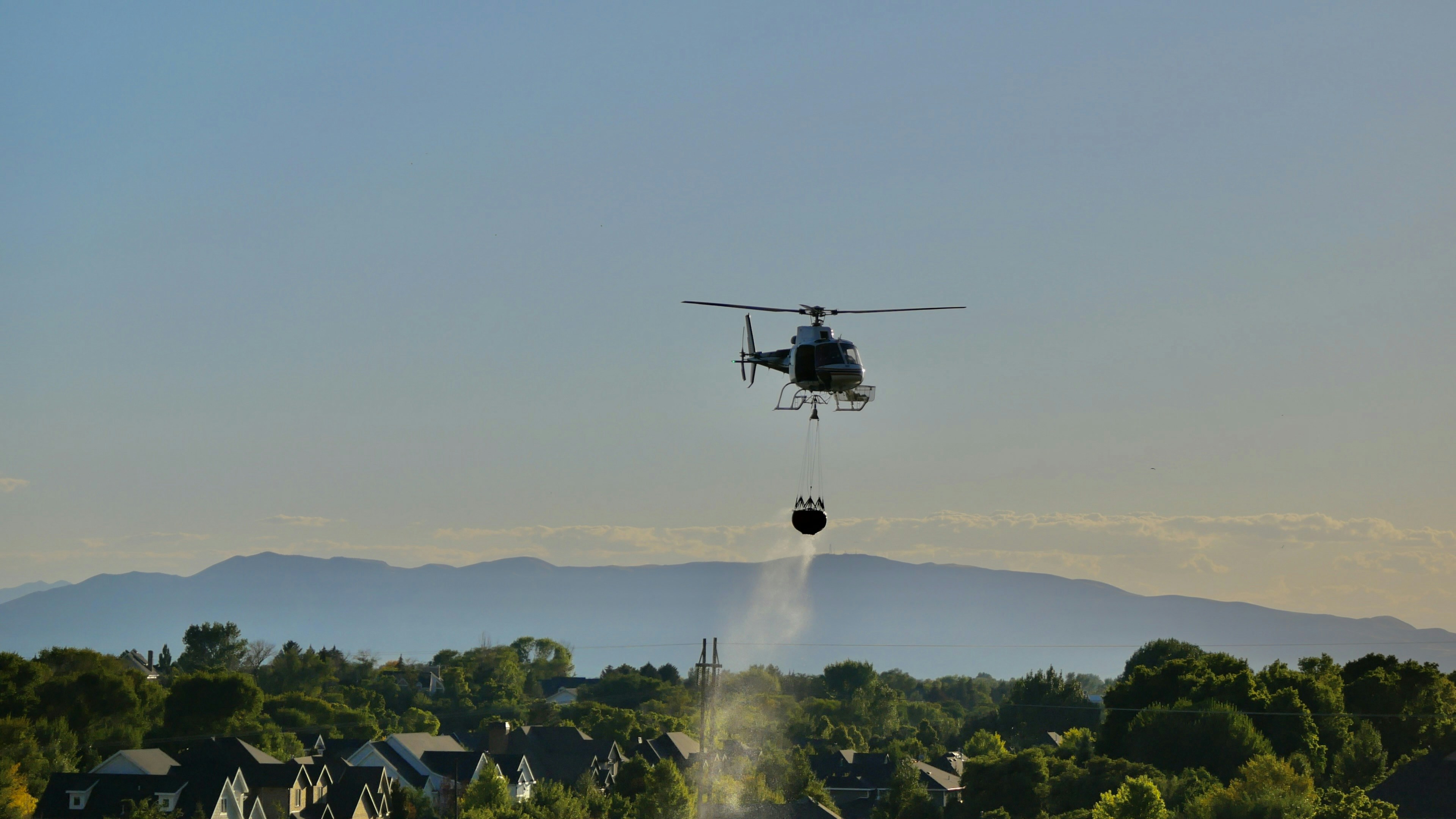 Firefighting helicopters dropping water on the Sandy Fire in Simi Valley