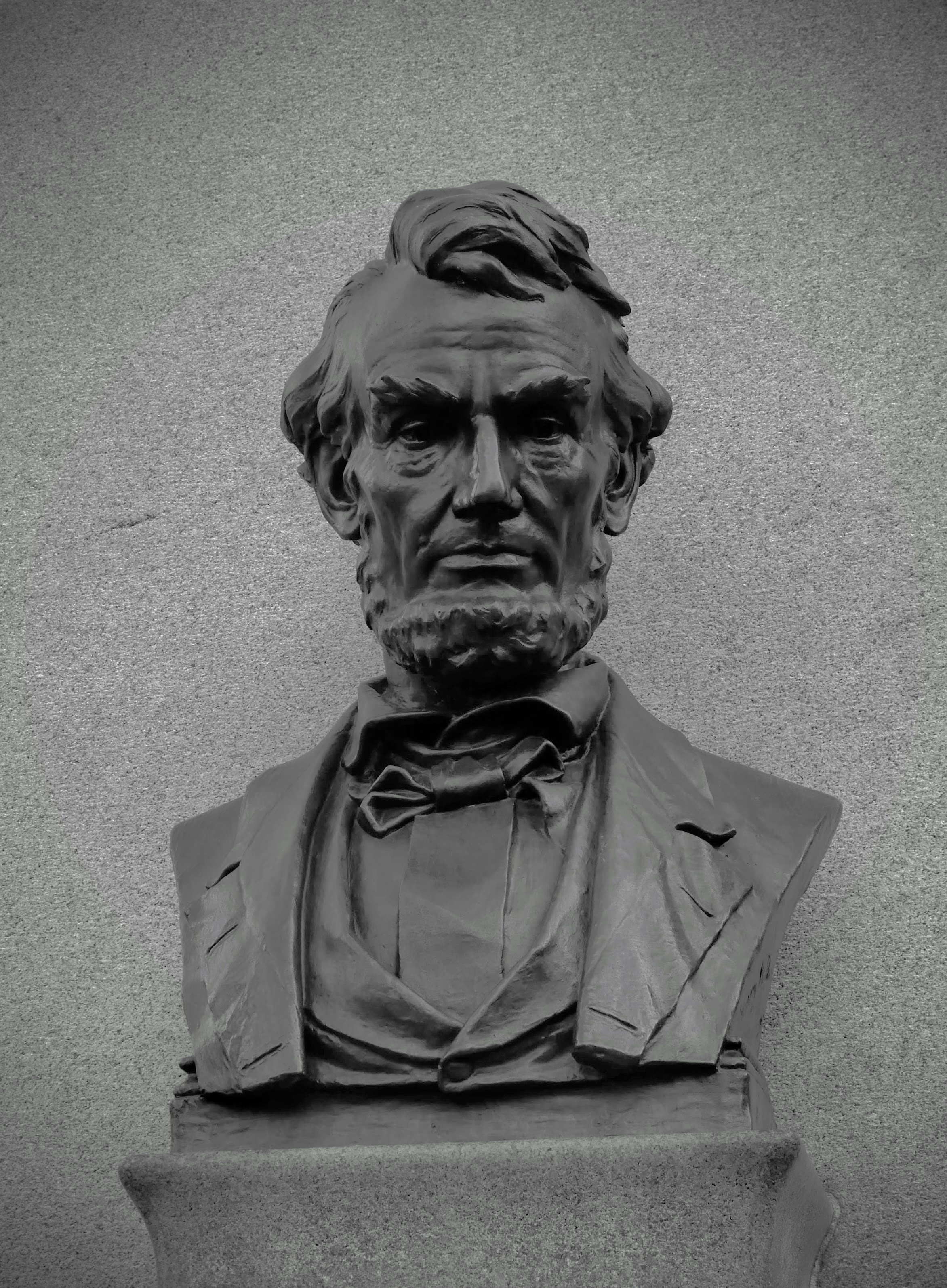 Bust of abraham lincoln against a textured background