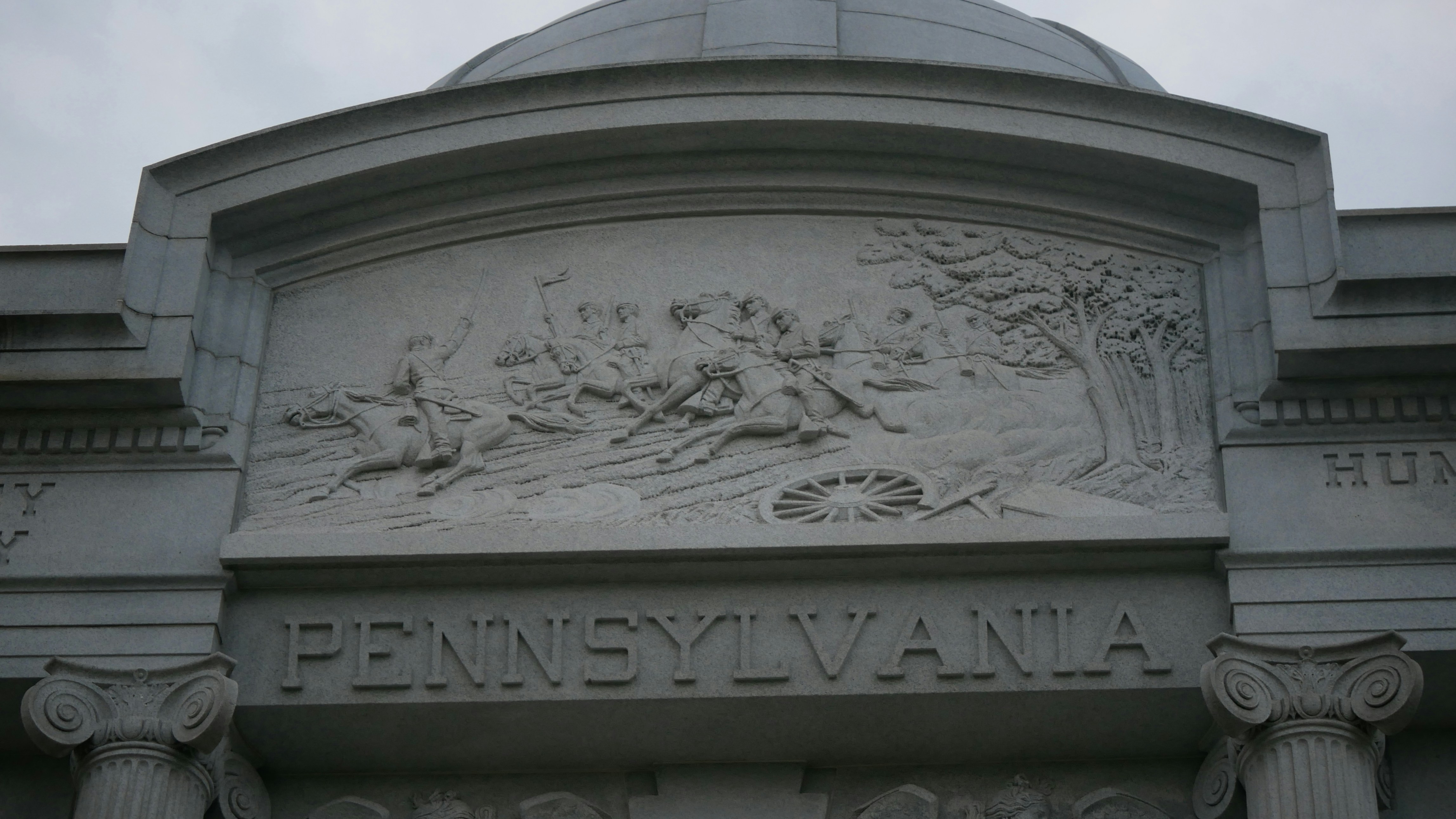 Bas-relief carving on a monument with "pennsylvania"