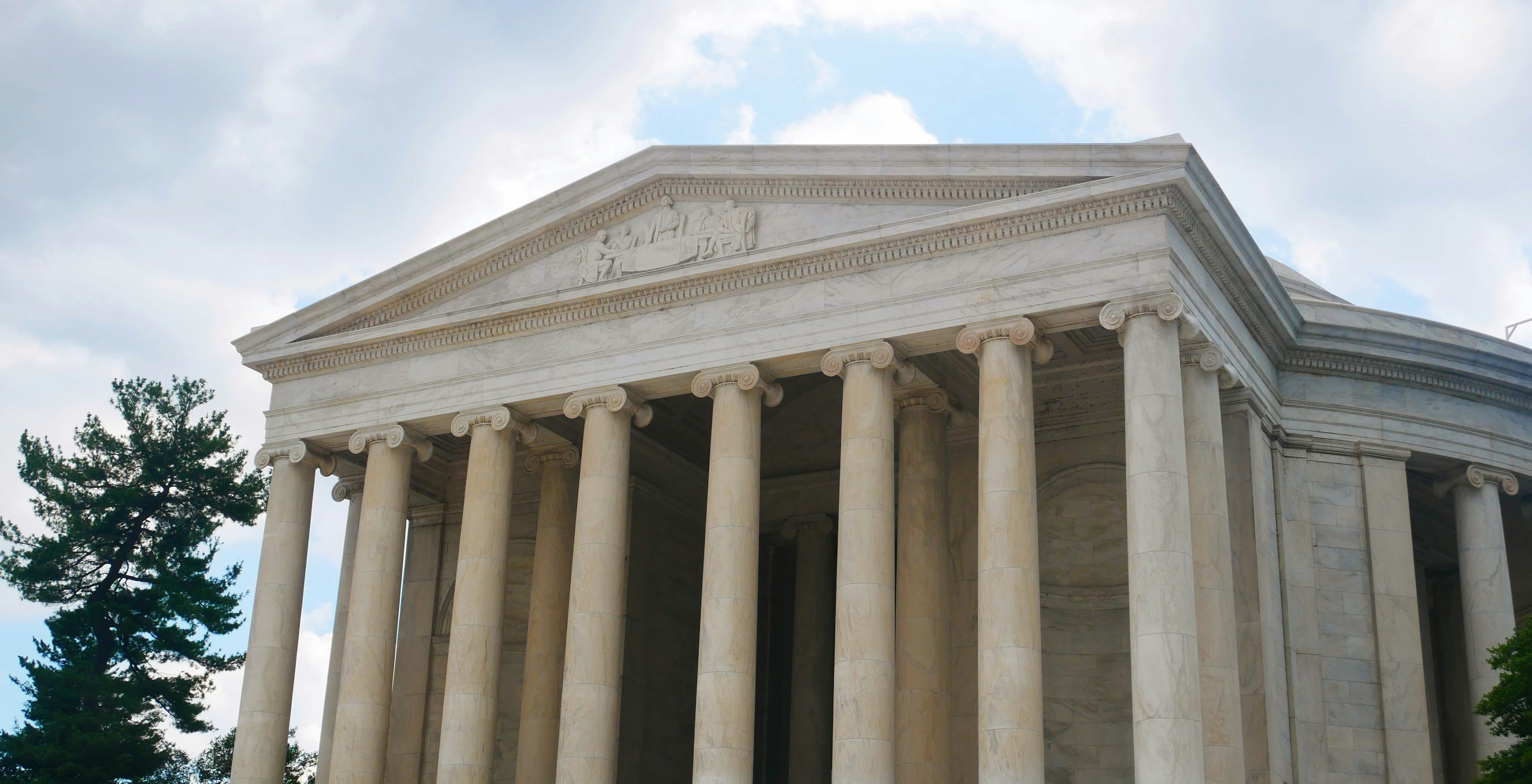 White marble building with columns and pediment