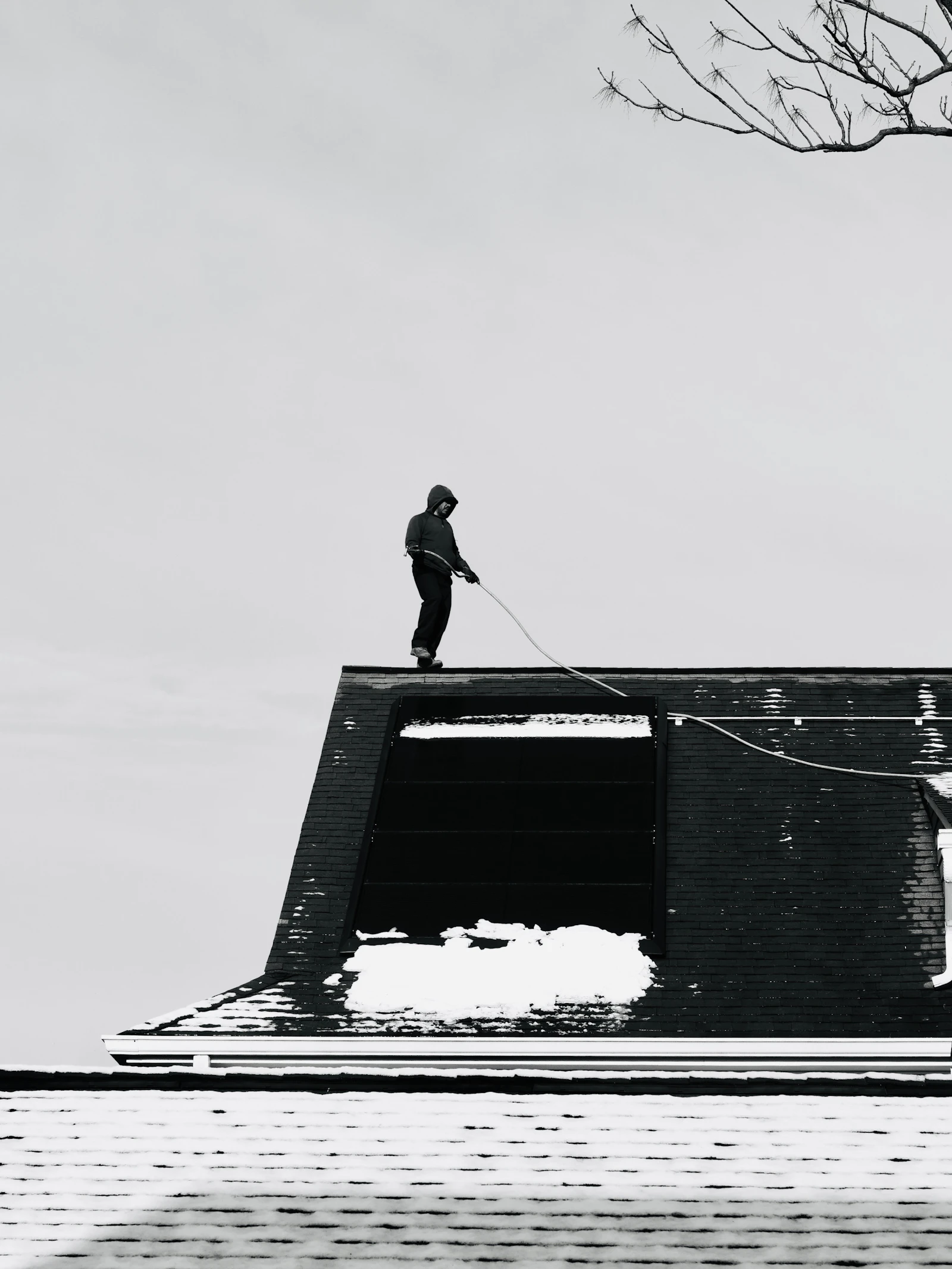 Roofing contractor Rockford IL on a snow-covered roof