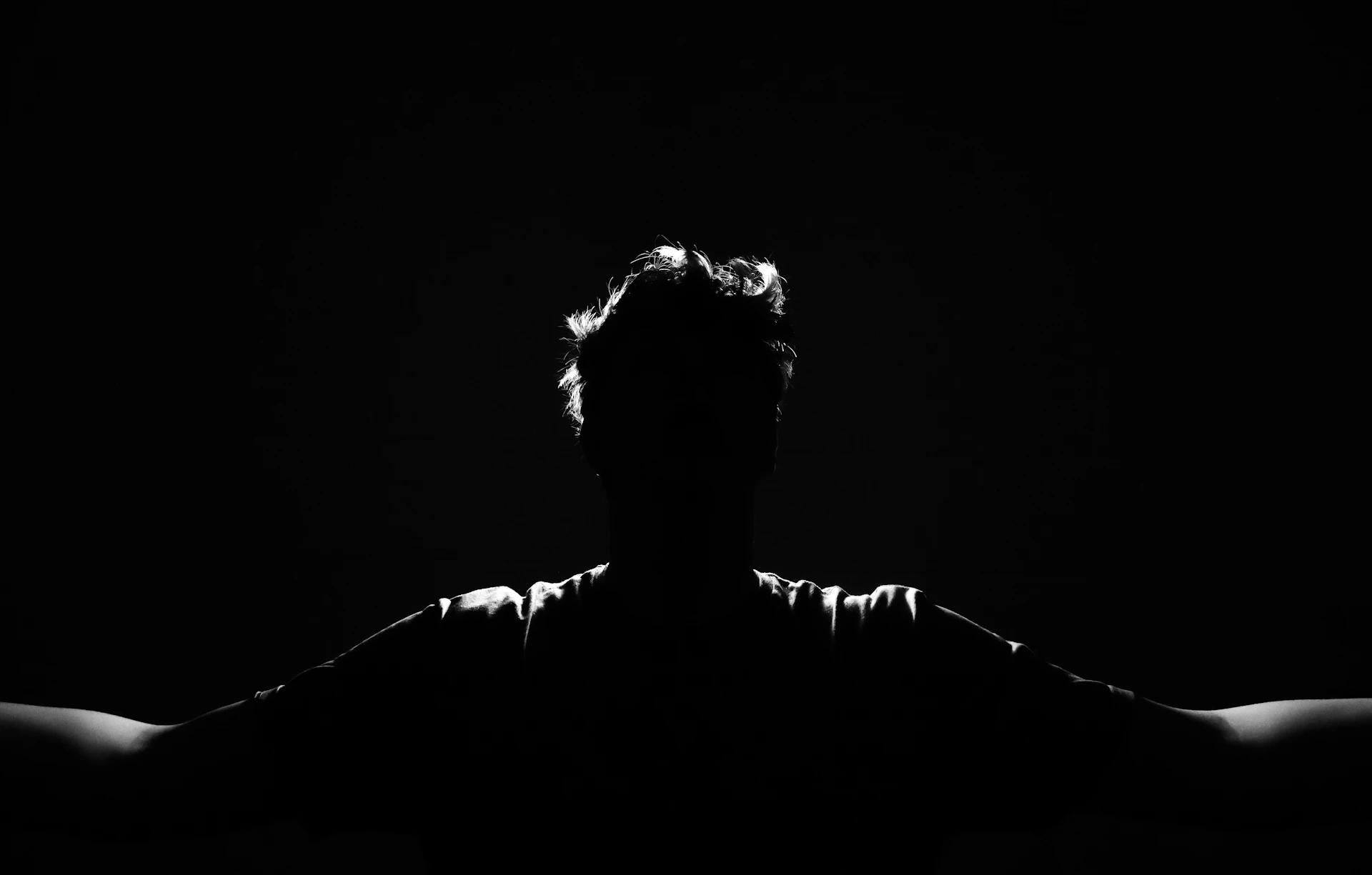 Silhouette of a person with arms outstretched