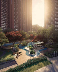 Modern apartment buildings with a serene park and water feature.