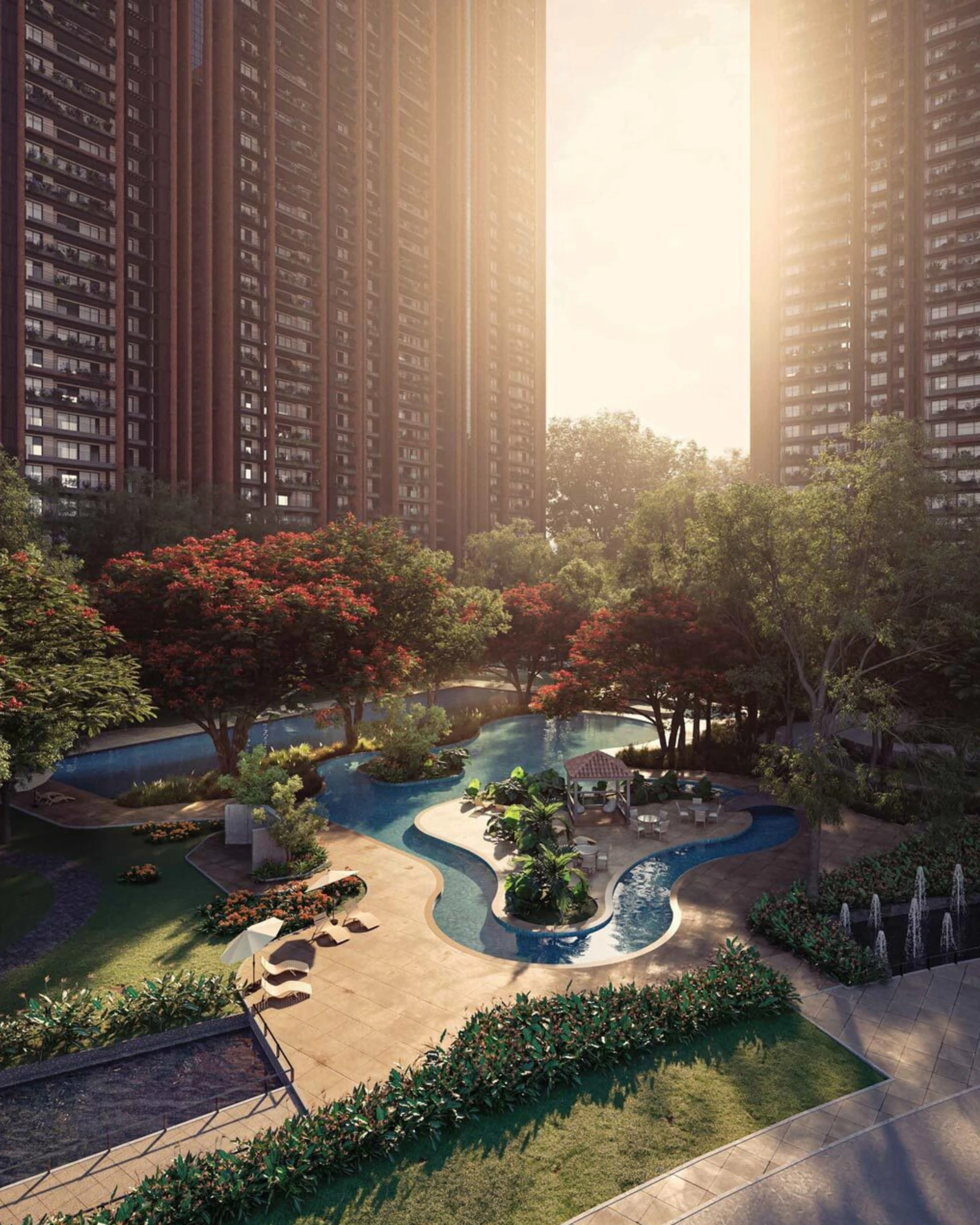 Modern apartment buildings with a serene park and water feature.