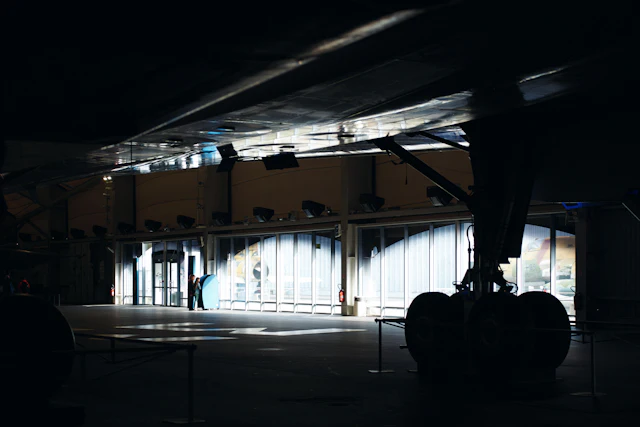 Aircraft landing gear inside a maintenance hangar