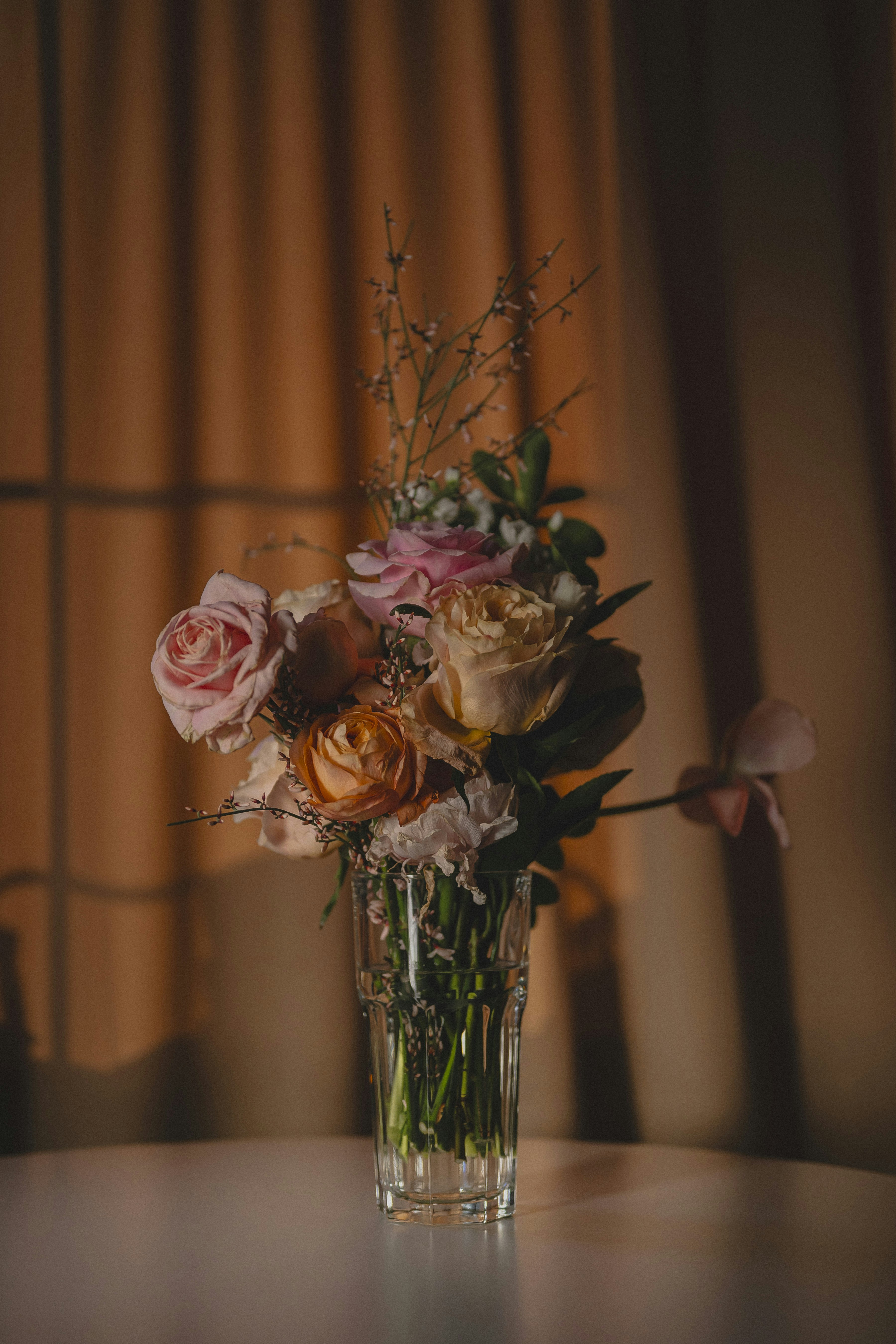 A bouquet of roses in a glass vase