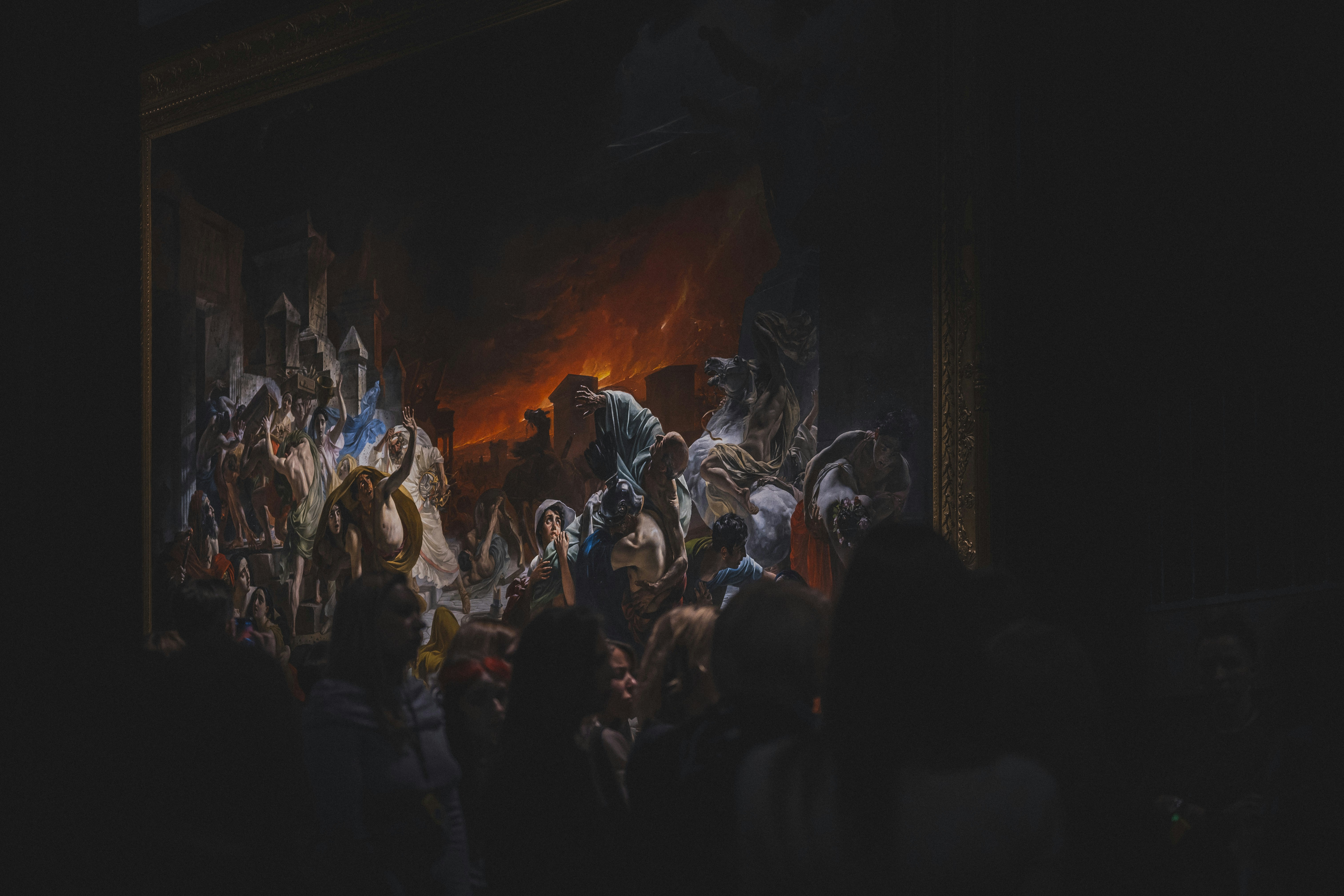 A dark painting depicting a chaotic scene with fire.