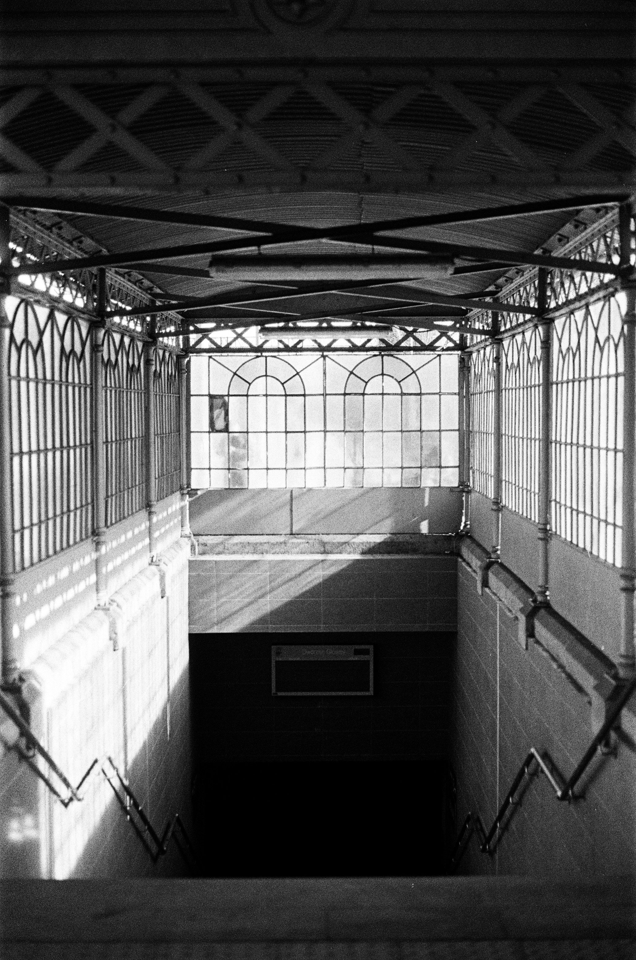 Stairway leading down into a subway station entrance.