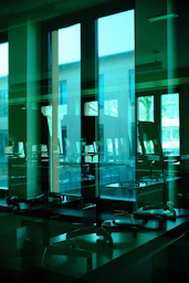 Modern office interior with reflective glass partitions