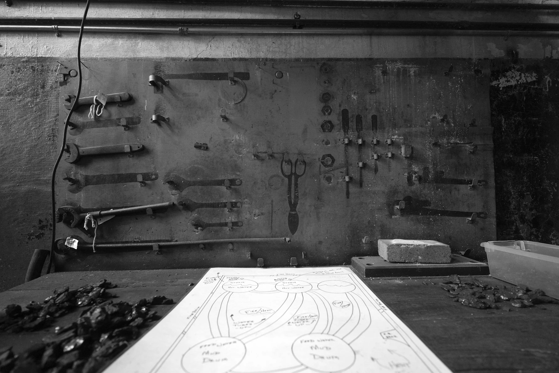 Workshop wall with organized tools above a practical workbench