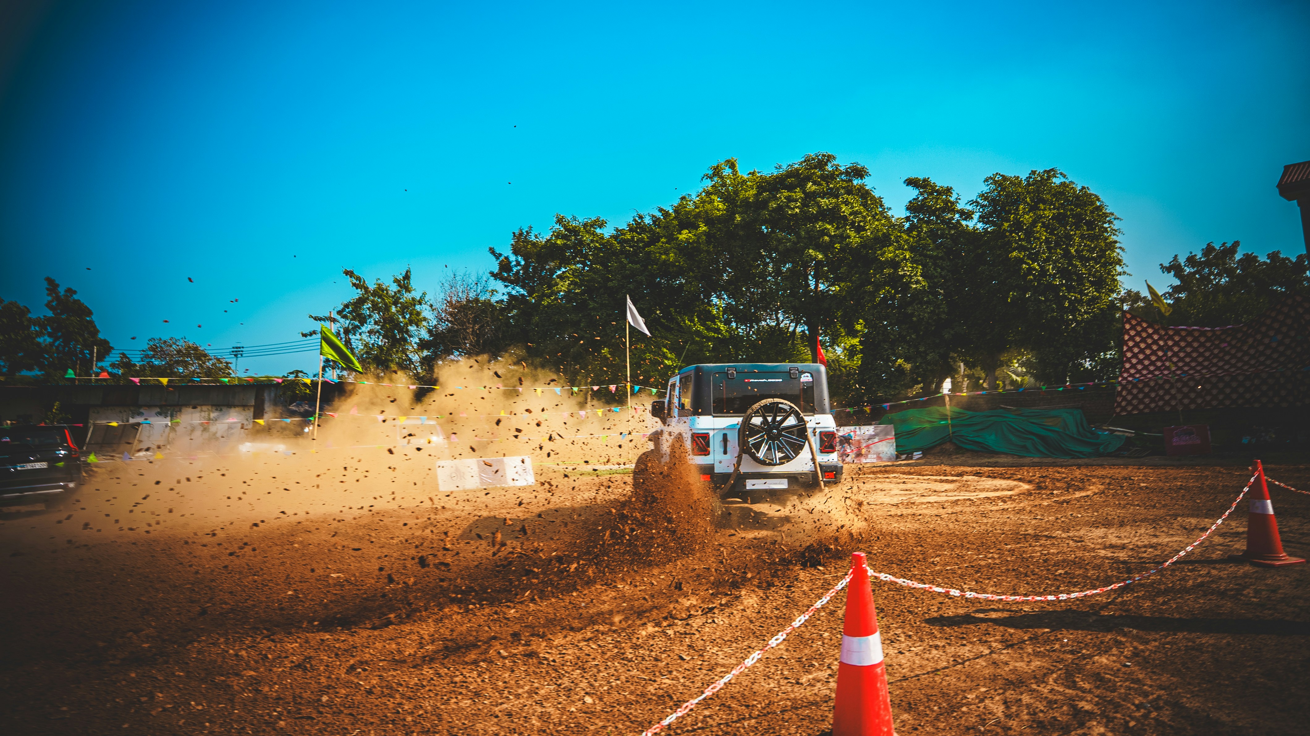 4x4 safari vehicle driving on a dusty road toward Serengeti Naabi Hill gate - kilimanjaro to serengeti