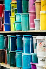 Shelves filled with colorful paint containers