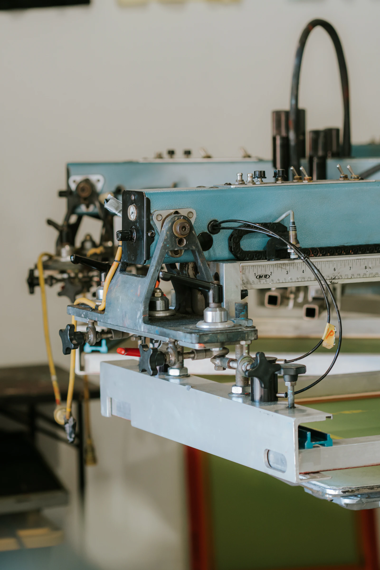 Screen printing equipment on a production floor