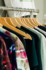 T-shirts on hangers in a retail display.