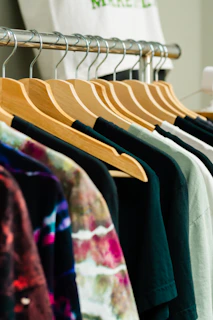T-shirts on hangers in a retail display.