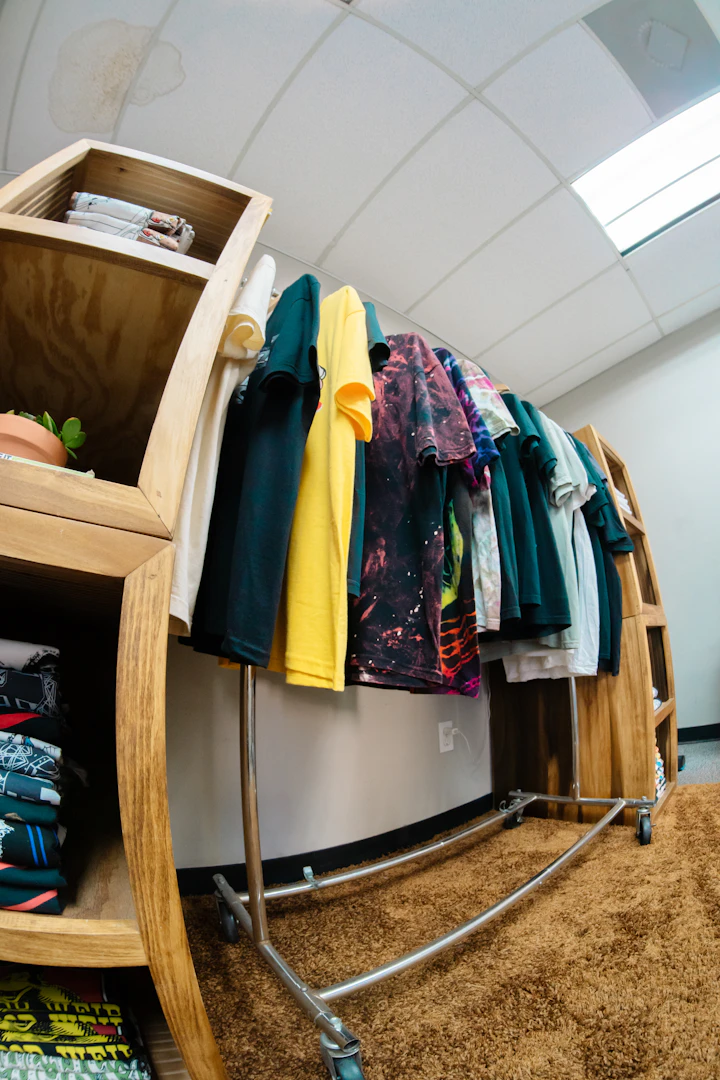 T-shirts hanging on a rack in a store