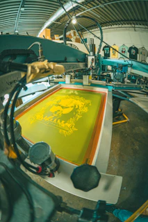 Screen printing machine with yellow ink design