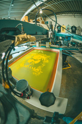 Screen printing machine with yellow ink design