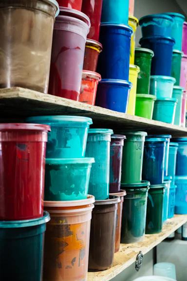 Shelves filled with colorful paint buckets