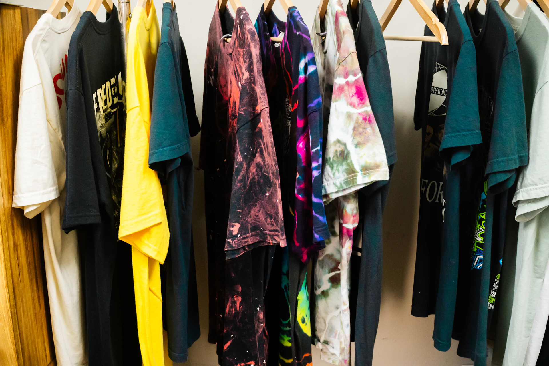 Assortment of t-shirts hanging on a rack