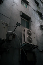 Exterior wall with air conditioning units and windows