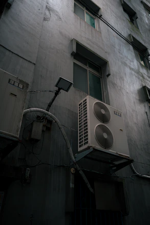 Exterior wall with air conditioning units and windows