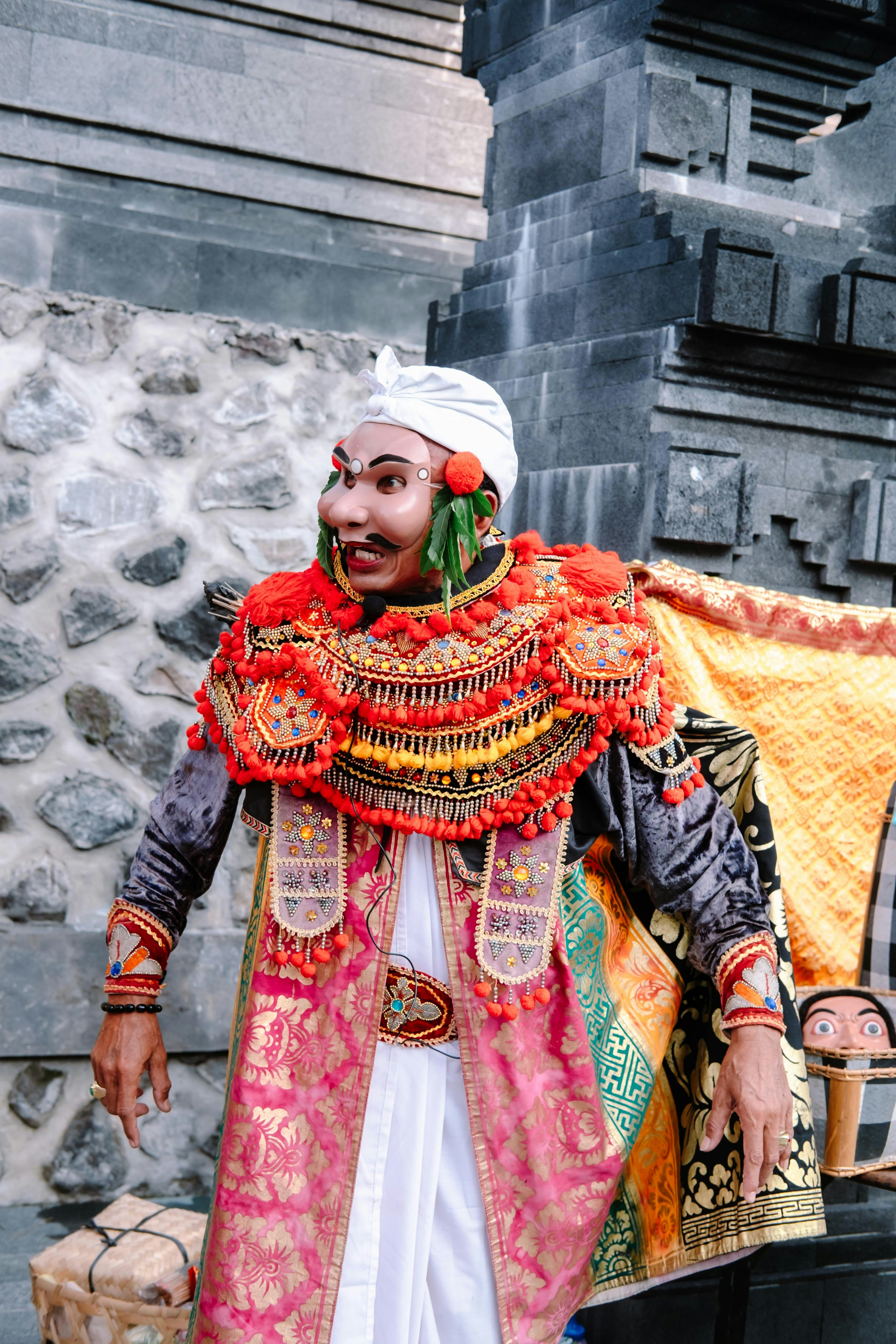 A performer in ornate traditional costume and mask. photo – Free ...
